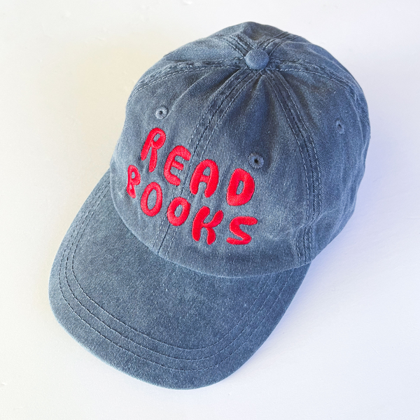 dark blue stone-washed cap embroidered with "read Books" in glossy red thread 