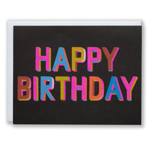 happy birthday in  3D block text (not literally, just drawn that way) in bright colours on a black background
